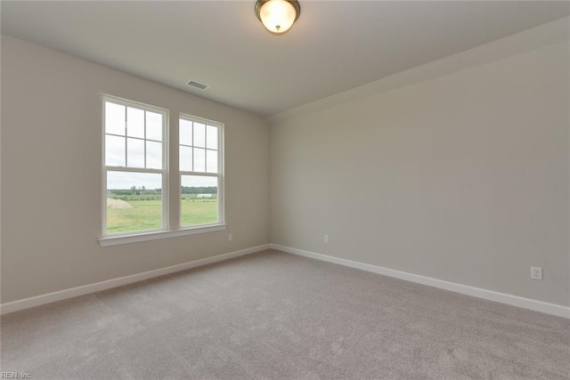 spare room featuring carpet floors