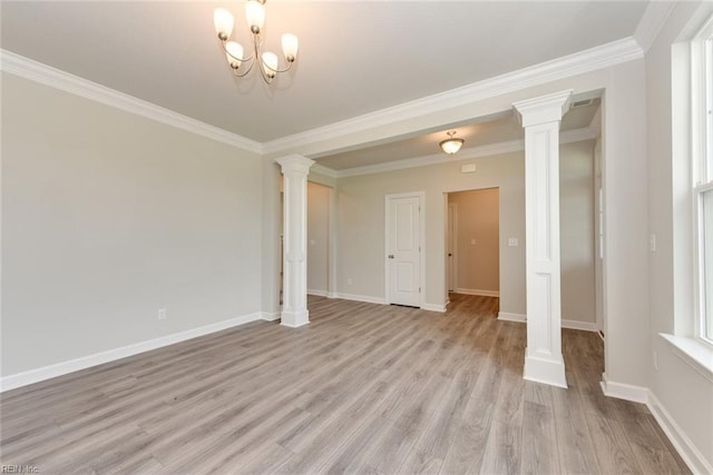 empty room featuring ornate columns, light wood-type flooring, and crown molding