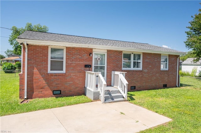 view of front facade featuring a front yard and a patio area