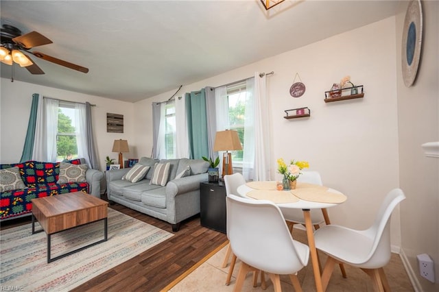 living room with ceiling fan and light wood-type flooring