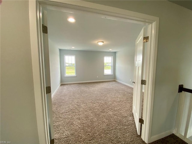 unfurnished room with carpet floors