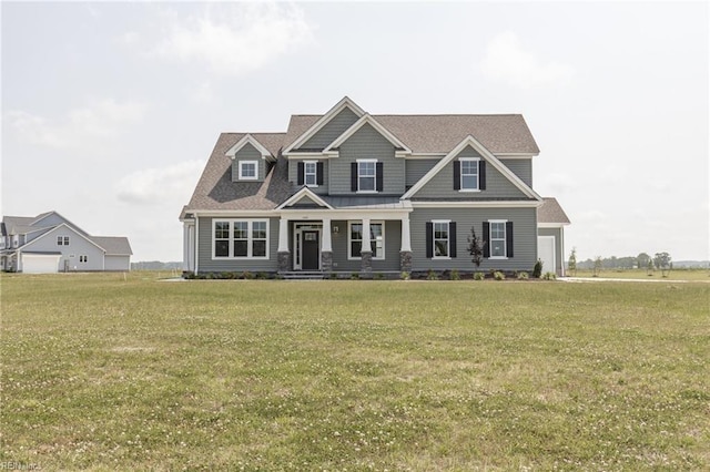 view of front of house featuring a front yard and a garage