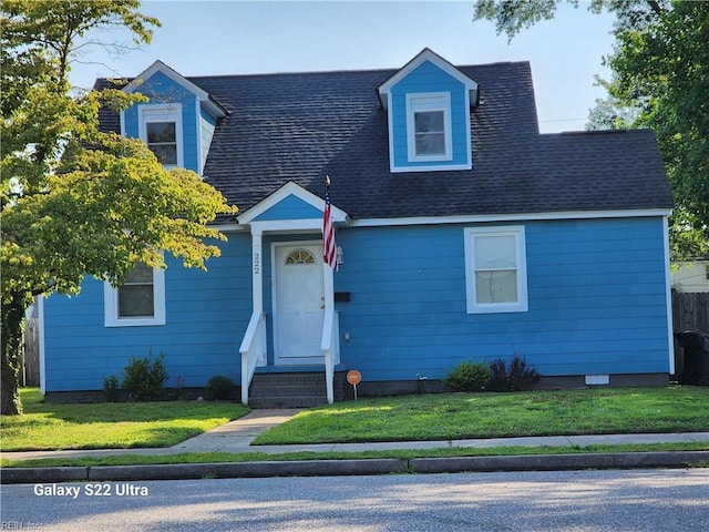 cape cod-style house with a front lawn