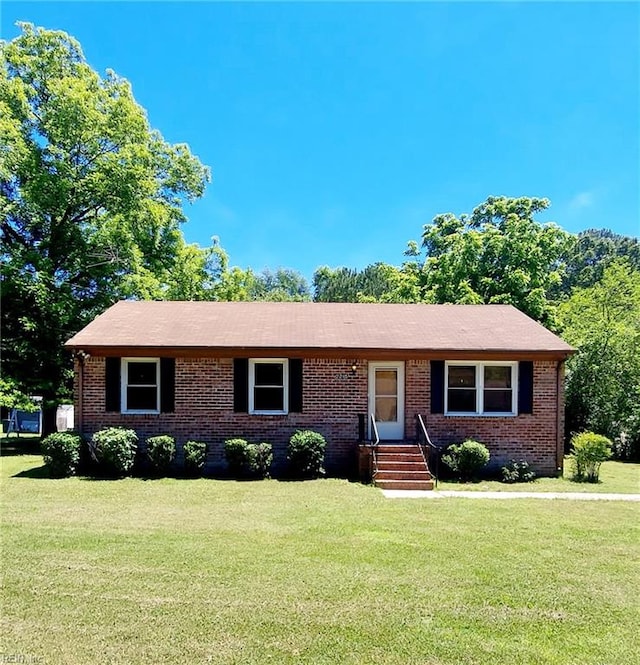 ranch-style house with a front lawn