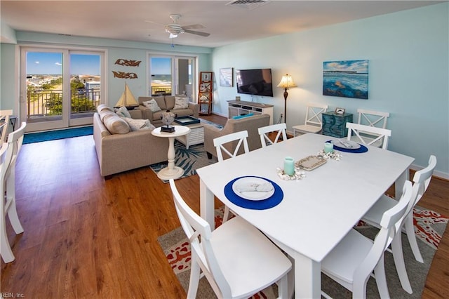 dining area featuring ceiling fan and hardwood / wood-style floors