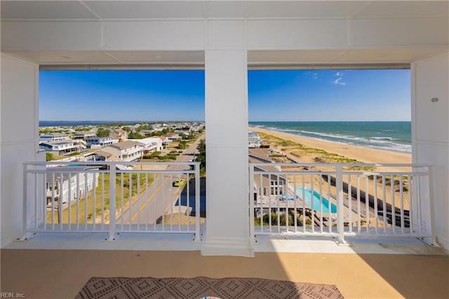 balcony with a view of the beach and a water view