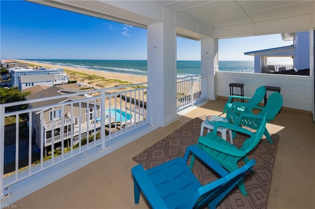 balcony with a view of the beach and a water view