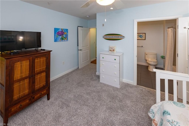 bedroom featuring ensuite bathroom, ceiling fan, and carpet floors