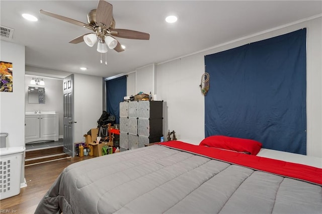 bedroom featuring hardwood / wood-style flooring and ceiling fan