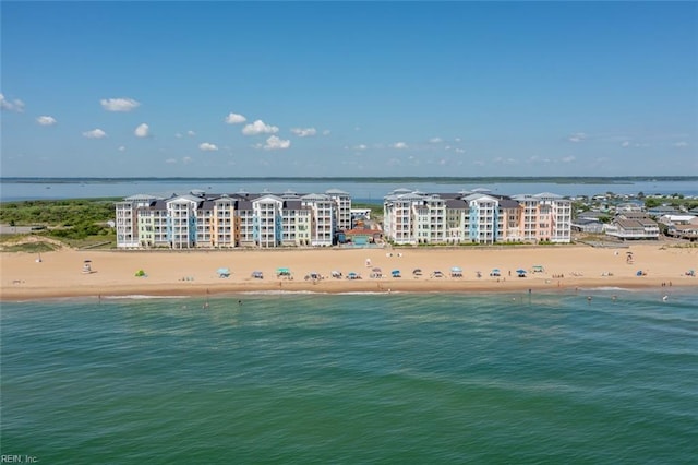 aerial view featuring a water view and a beach view