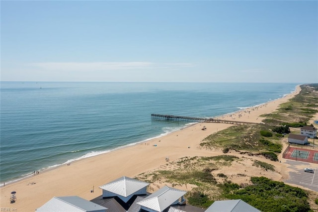 bird's eye view with a water view and a beach view