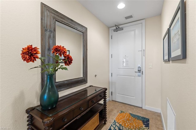 entryway featuring light tile patterned flooring