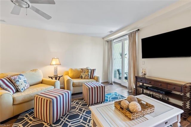 living room featuring hardwood / wood-style floors, french doors, and ceiling fan