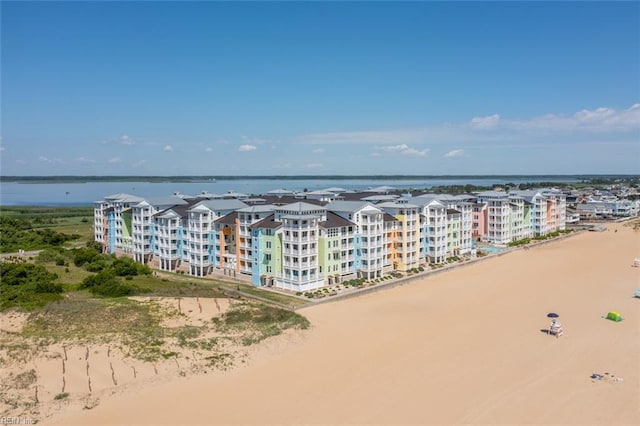 aerial view with a beach view and a water view