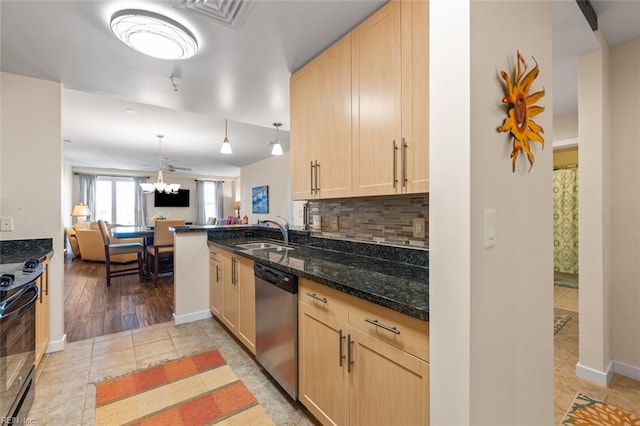 kitchen featuring light brown cabinetry, stainless steel dishwasher, decorative light fixtures, and sink