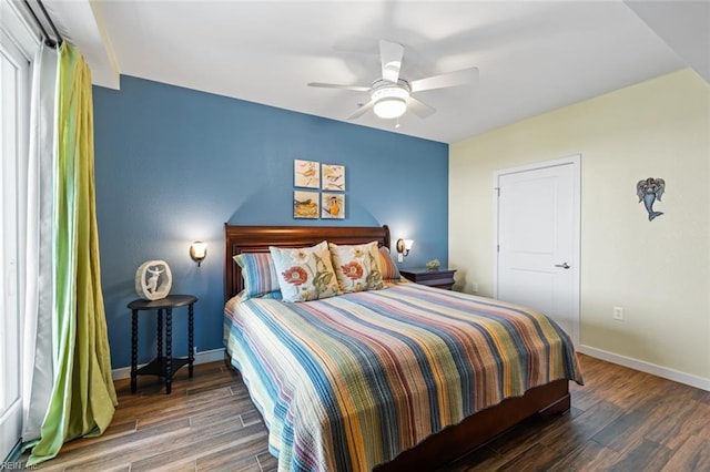 bedroom featuring ceiling fan and dark hardwood / wood-style flooring