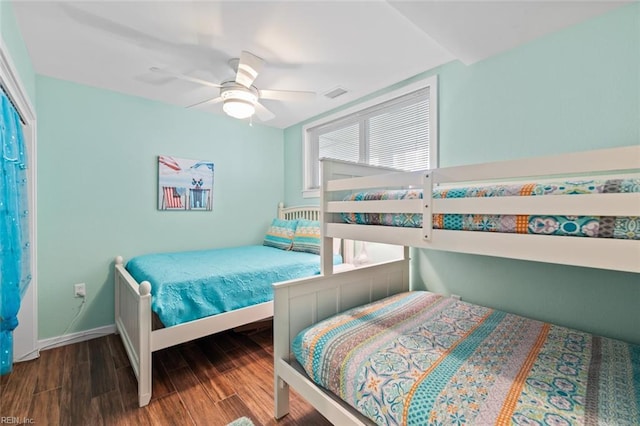 bedroom with ceiling fan and wood-type flooring