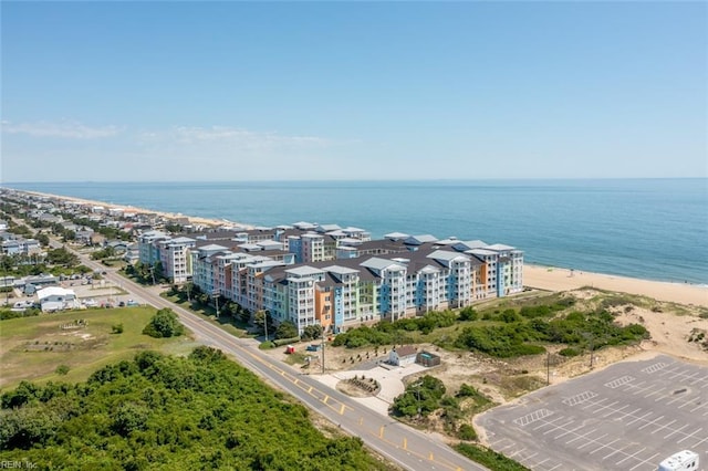 birds eye view of property with a view of the beach and a water view