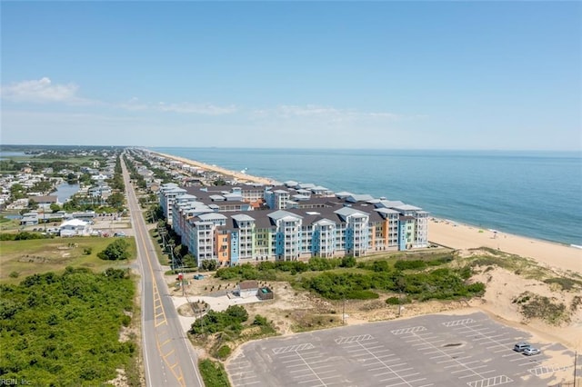 birds eye view of property with a water view and a view of the beach