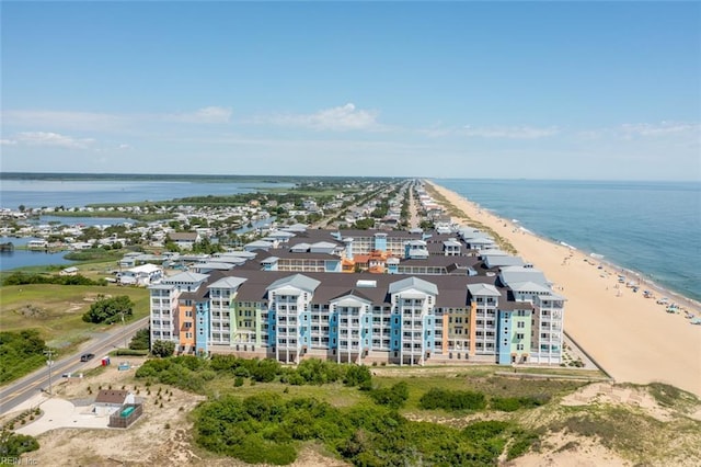 aerial view with a water view and a beach view