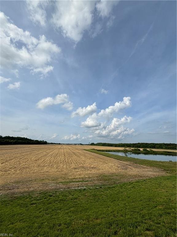 view of home's community with a rural view and a water view