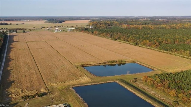 birds eye view of property with a water view and a rural view