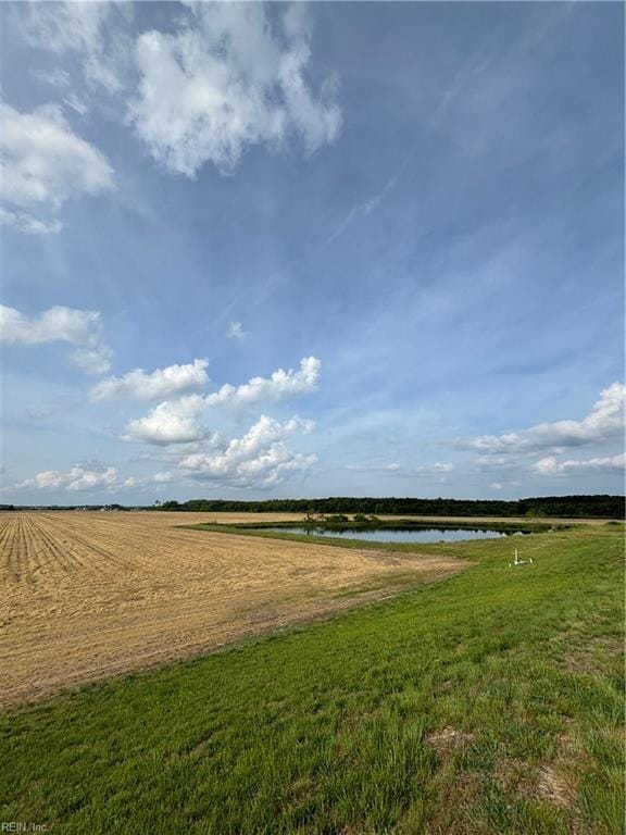 exterior space featuring a rural view and a water view