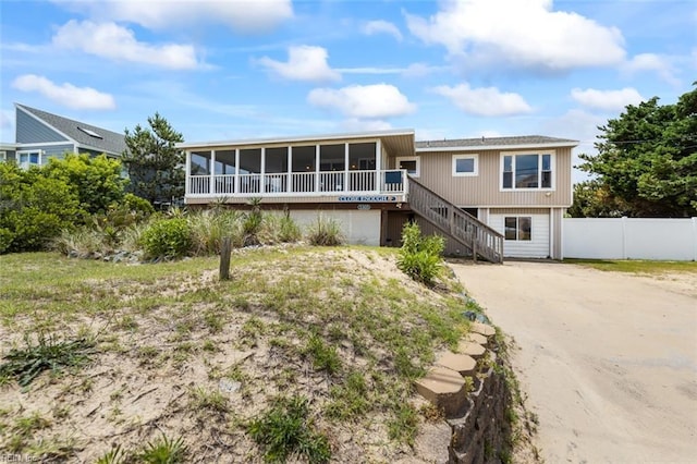 view of front of property with a sunroom