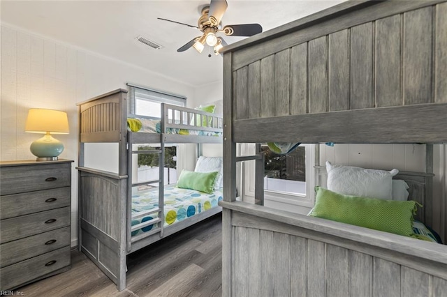 bedroom featuring ceiling fan and dark wood-type flooring