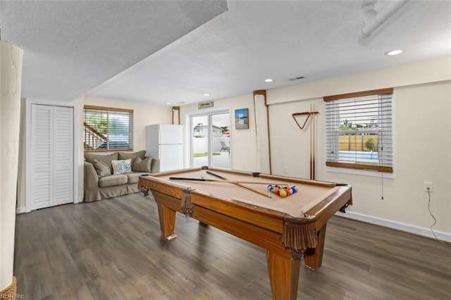 recreation room with a textured ceiling, dark hardwood / wood-style floors, and billiards