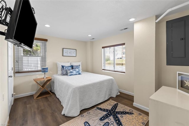 bedroom featuring dark hardwood / wood-style floors and electric panel