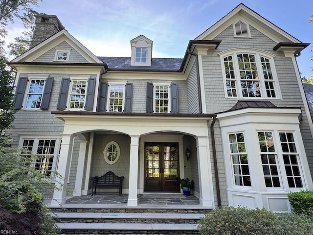 exterior space featuring french doors and covered porch