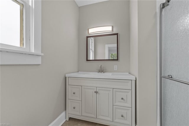 bathroom featuring vanity and tile floors