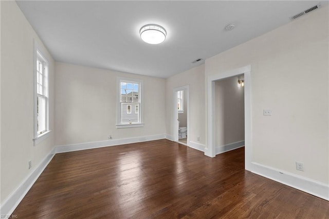 empty room featuring dark hardwood / wood-style floors