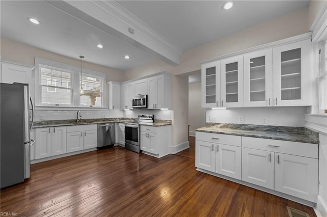 kitchen featuring dark hardwood / wood-style flooring, white cabinetry, and appliances with stainless steel finishes