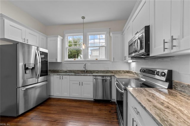 kitchen with sink, dark wood-type flooring, white cabinets, and appliances with stainless steel finishes