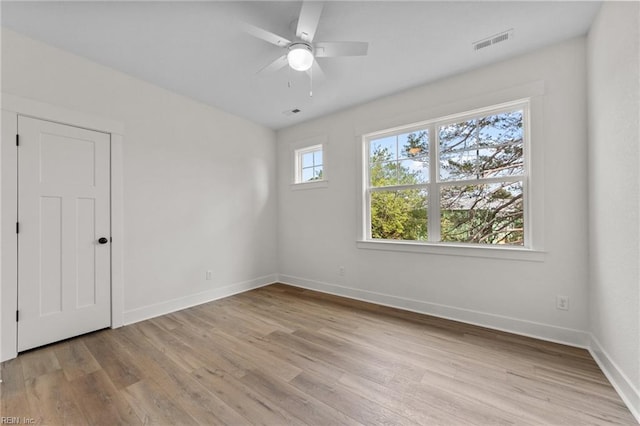 unfurnished room featuring ceiling fan and light wood-type flooring