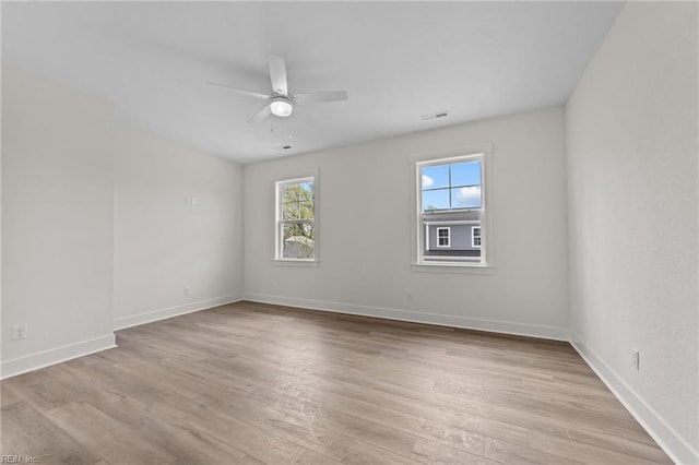 unfurnished room featuring ceiling fan and light hardwood / wood-style floors