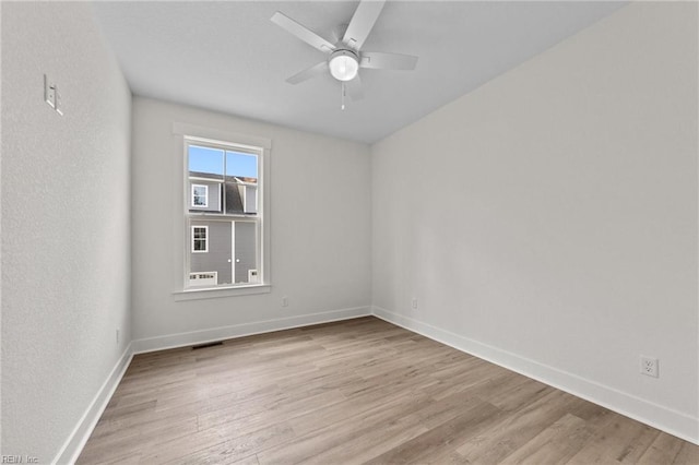 unfurnished room featuring ceiling fan and light hardwood / wood-style floors