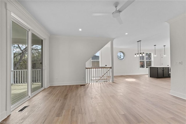 unfurnished room with ceiling fan, crown molding, and light hardwood / wood-style flooring