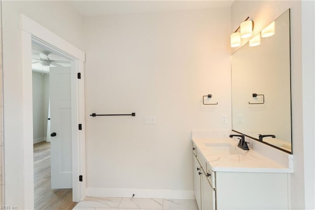 bathroom with ceiling fan and vanity