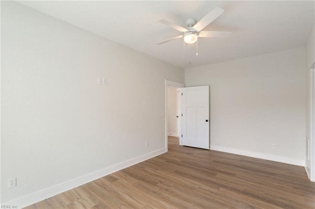 spare room featuring ceiling fan and wood-type flooring