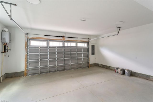 garage featuring water heater and electric panel