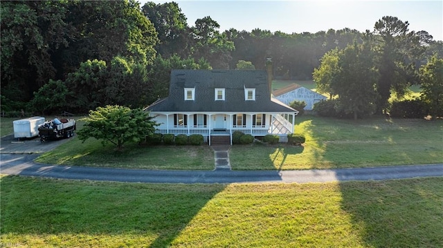 view of front of property with a porch and a front yard