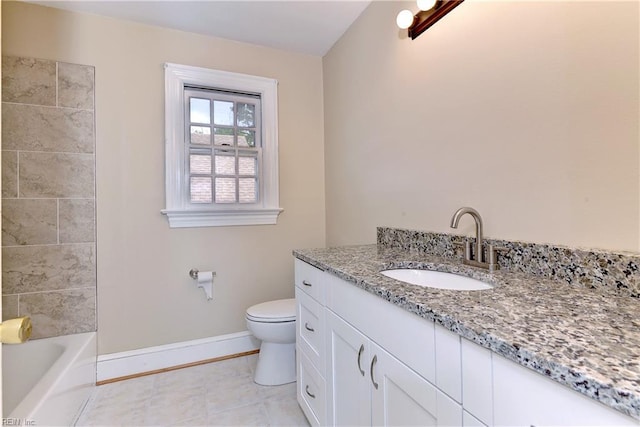 bathroom with tile patterned floors, vanity, and toilet