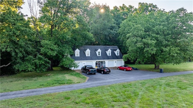 new england style home featuring a front yard