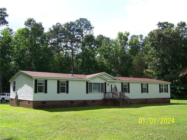 34026 Doctors Rd, Newsoms, VA 23874 - manufactured / mobile home with roof with shingles, a front lawn, and crawl space
