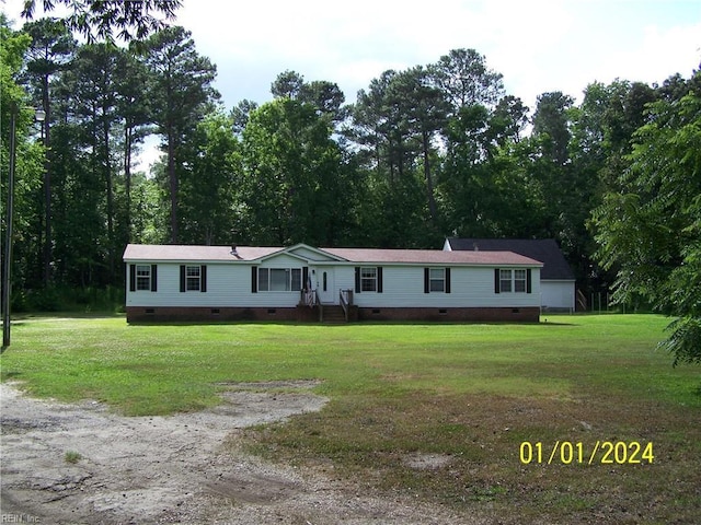 34026 Doctors Rd, Newsoms, VA 23874 - manufactured / mobile home with dirt driveway, a front yard, and crawl space