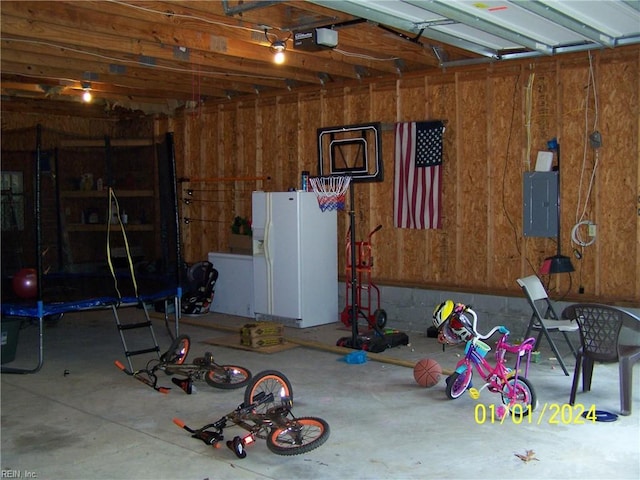34026 Doctors Rd, Newsoms, VA 23874 - garage featuring white refrigerator with ice dispenser and electric panel