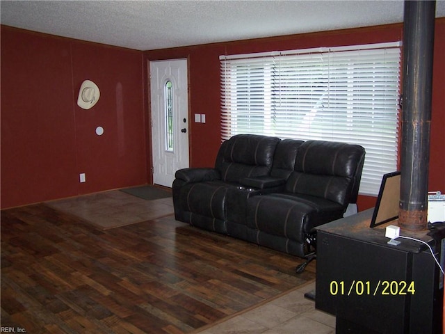 34026 Doctors Rd, Newsoms, VA 23874 - living area featuring a textured ceiling and wood finished floors